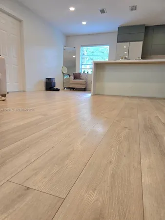 a view of kitchen with furniture and window