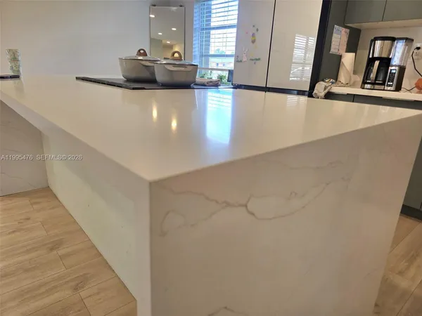 a view of a kitchen with a sink
