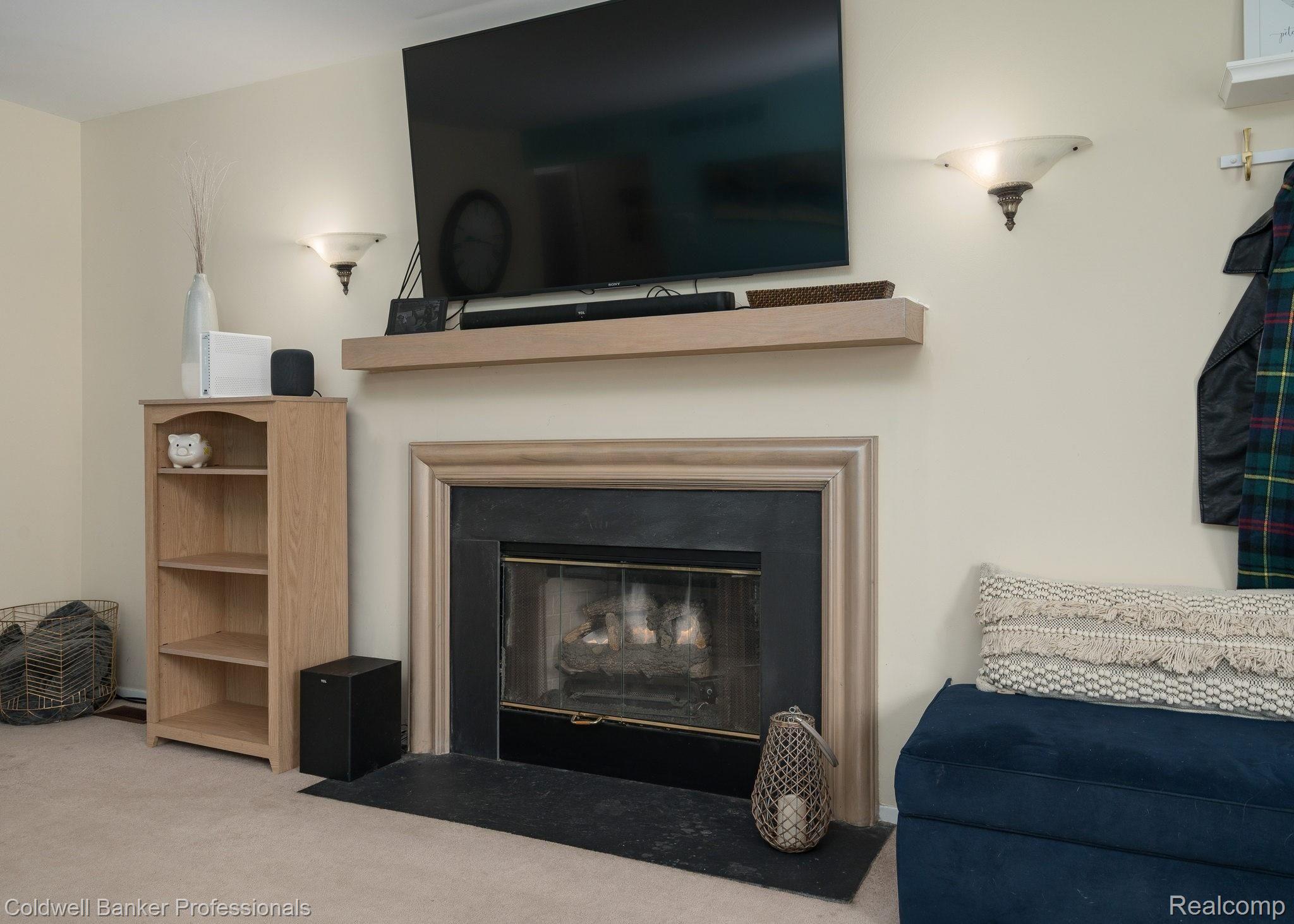 3048 High Pointe Ridge Road, Unit 47 Lake Orion, MI 48359 - Photo 6 of 21 Warm up by the gas fireplace!