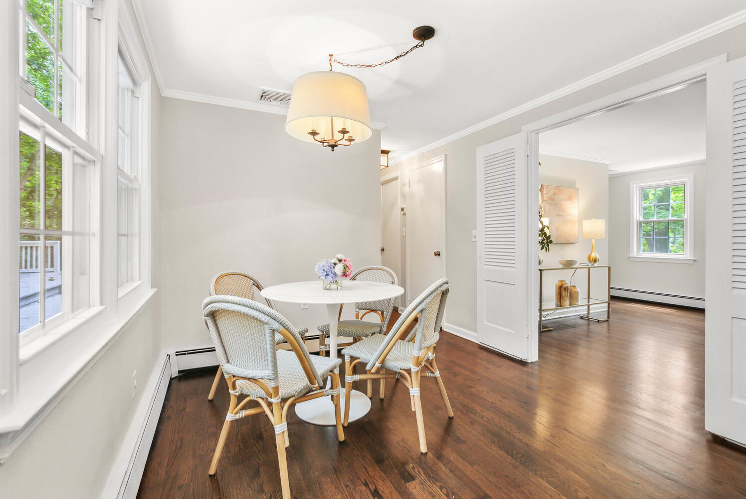 210 Tokeneke Road Darien, CT 06820 - Photo 13 of 24 a view of a dining room with furniture and wooden floor