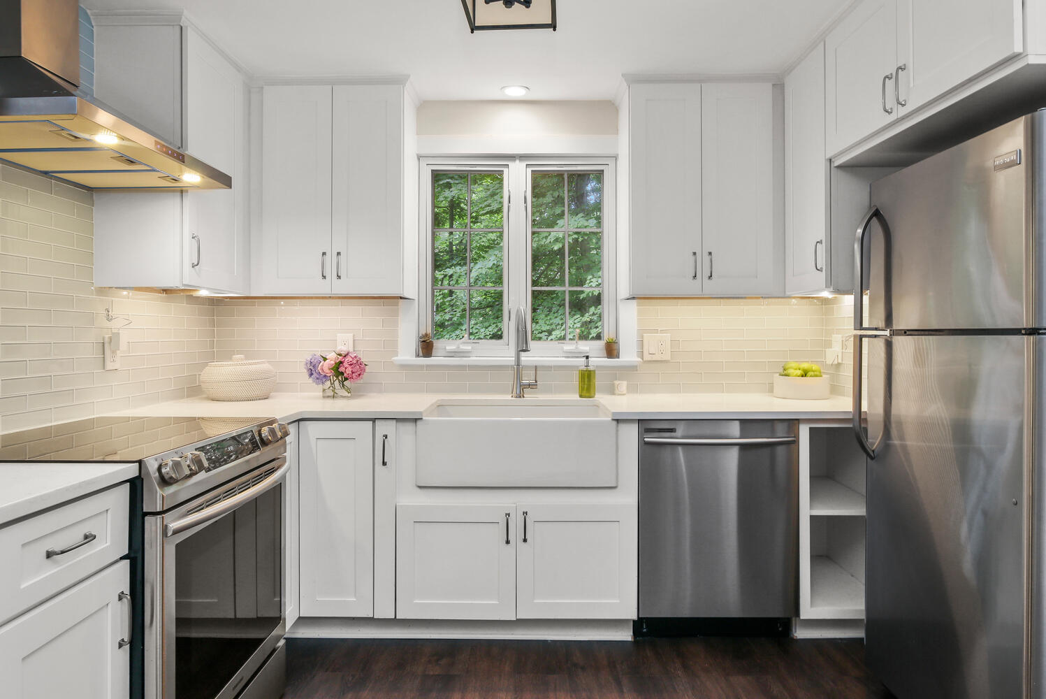 210 Tokeneke Road Darien, CT 06820 - Photo 14 of 24 a kitchen with a white cabinets and white appliances