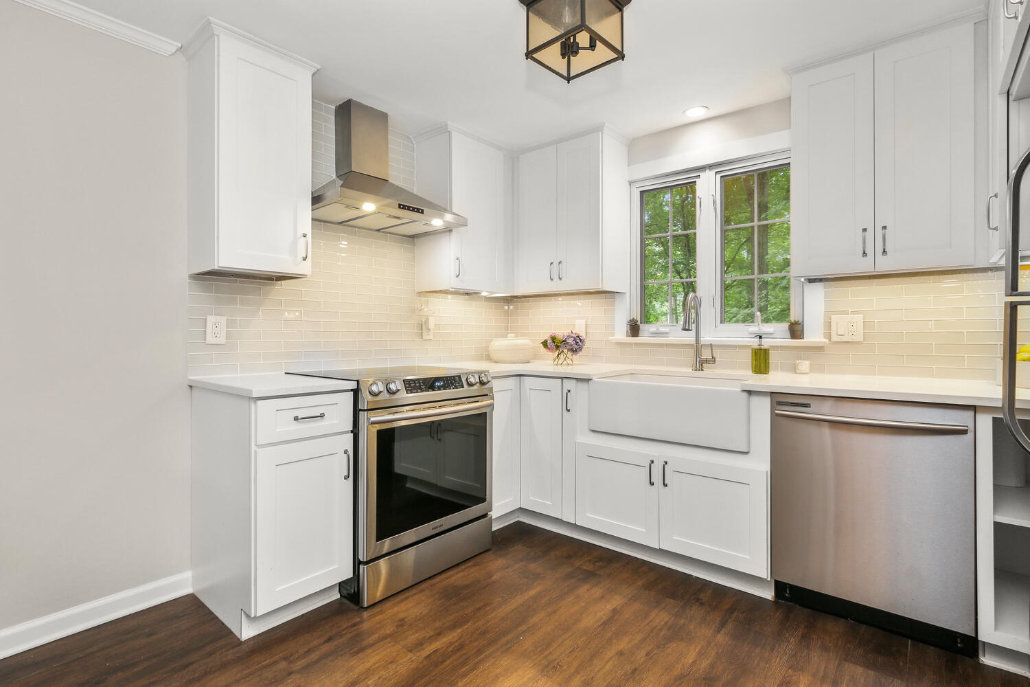 210 Tokeneke Road Darien, CT 06820 - Photo 16 of 24 a kitchen with stainless steel appliances white cabinets and a sink