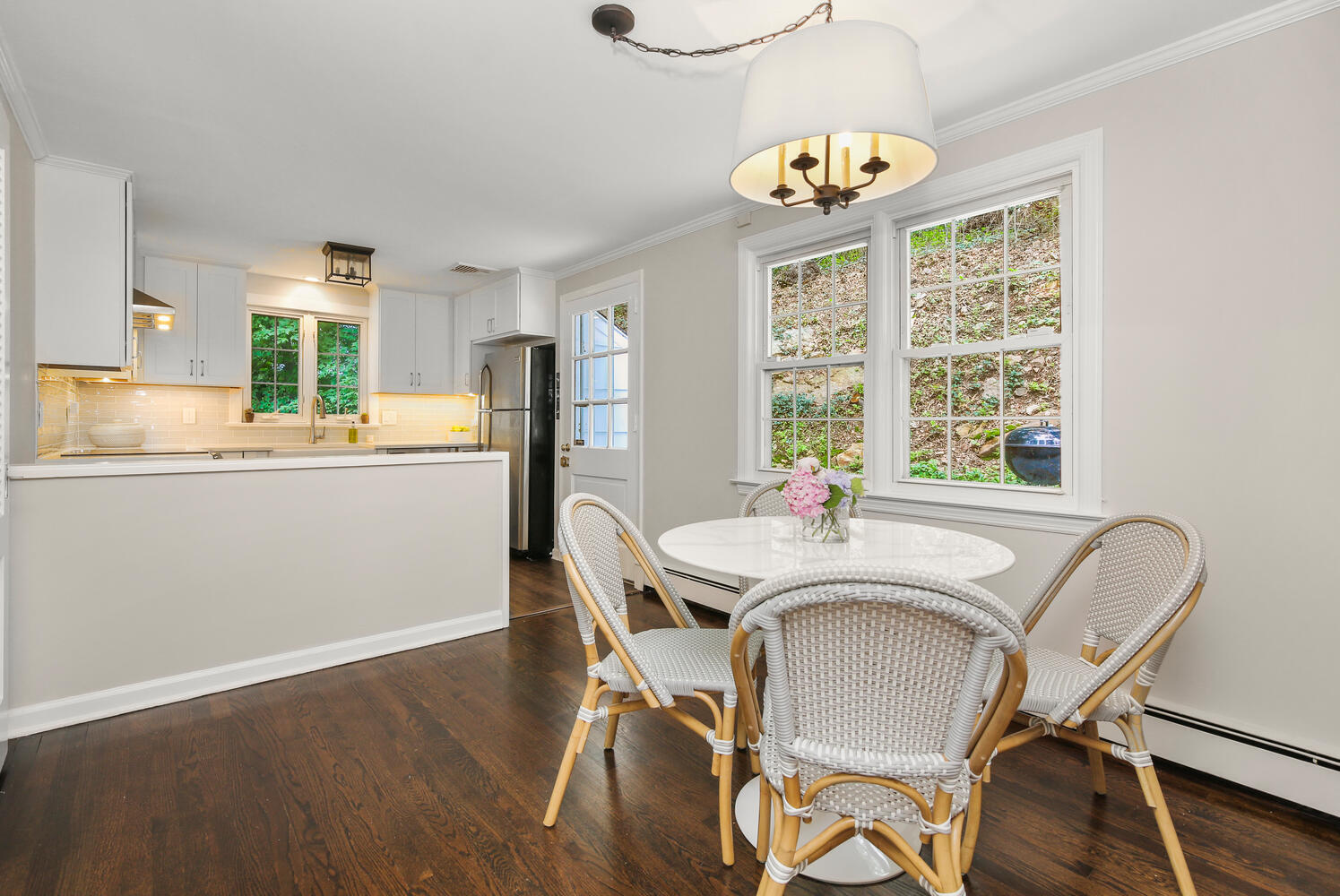 210 Tokeneke Road Darien, CT 06820 - Photo 17 of 24 a view of a dining room with furniture a chandelier and wooden floor