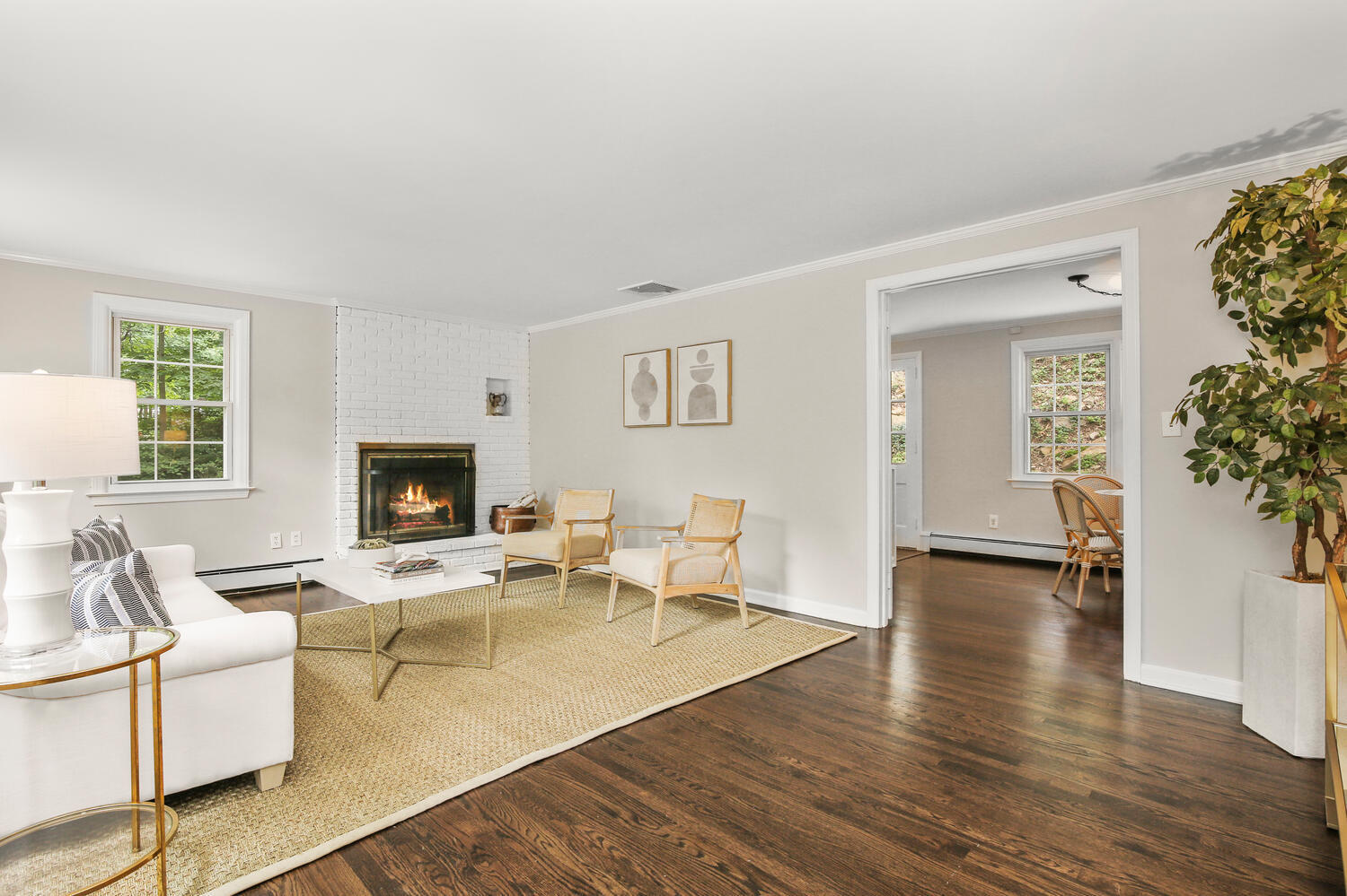 210 Tokeneke Road Darien, CT 06820 - Photo 8 of 24 a living room with furniture and a fireplace