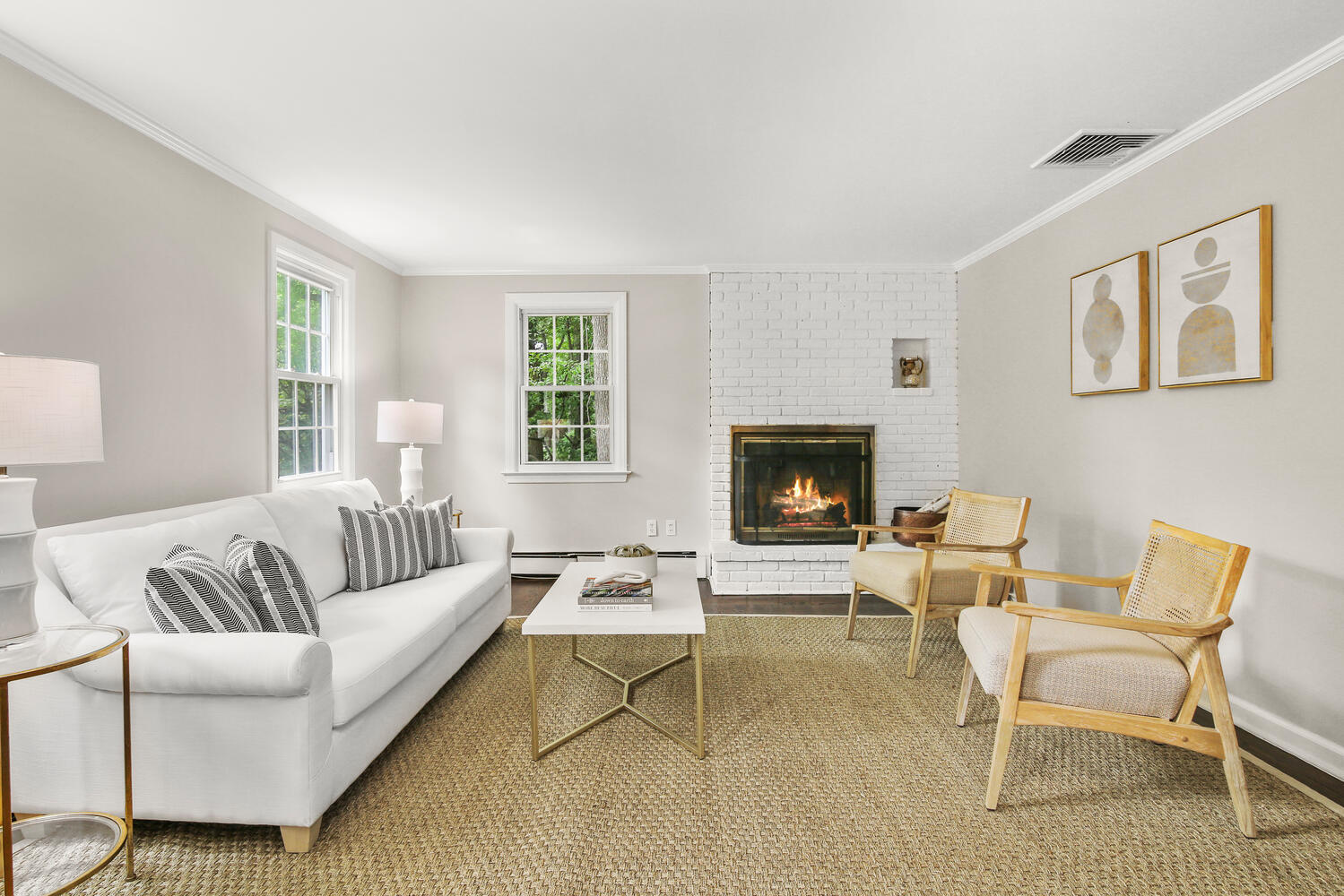 210 Tokeneke Road Darien, CT 06820 - Photo 9 of 24 a living room with furniture wooden floor and a fireplace