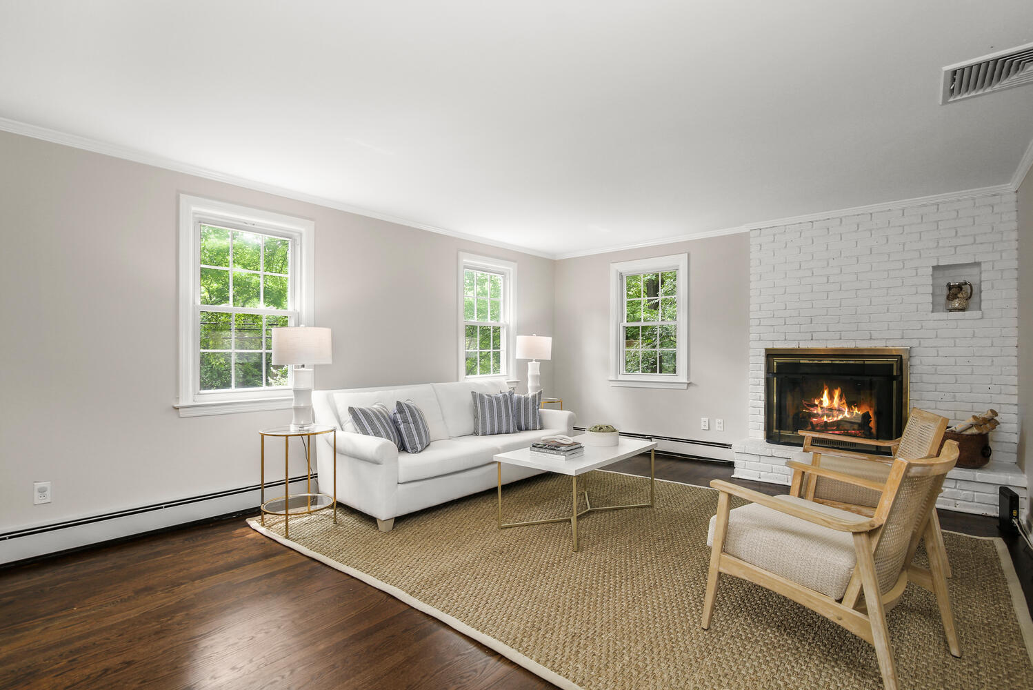 210 Tokeneke Road Darien, CT 06820 - Photo 10 of 24 a living room with furniture and a fireplace