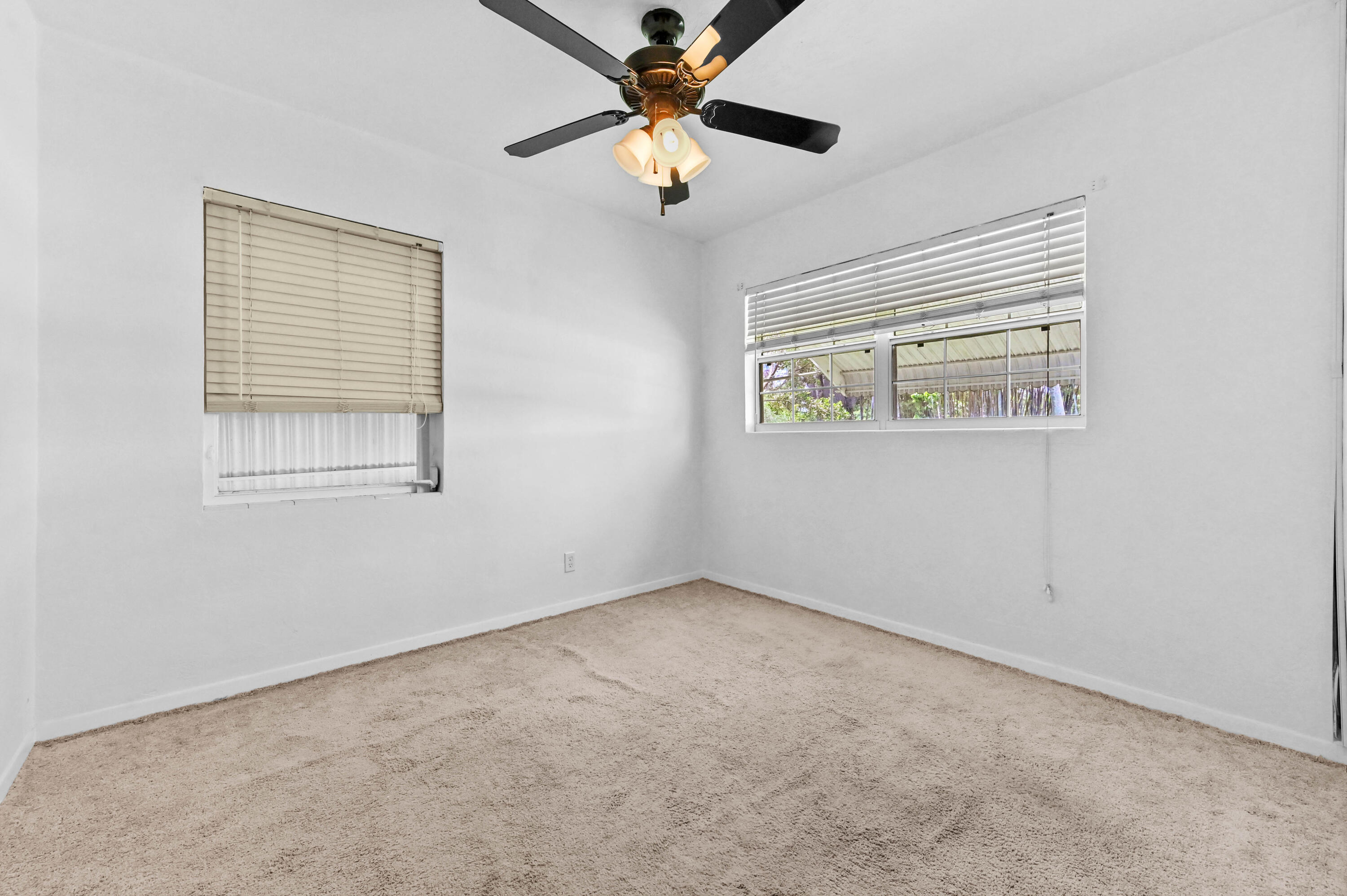 5709 Southeast Indigo Avenue Stuart, FL 34997 - Photo 19 of 26 a view of an empty room with a window