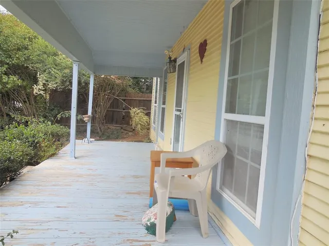 a chair and table in a balcony