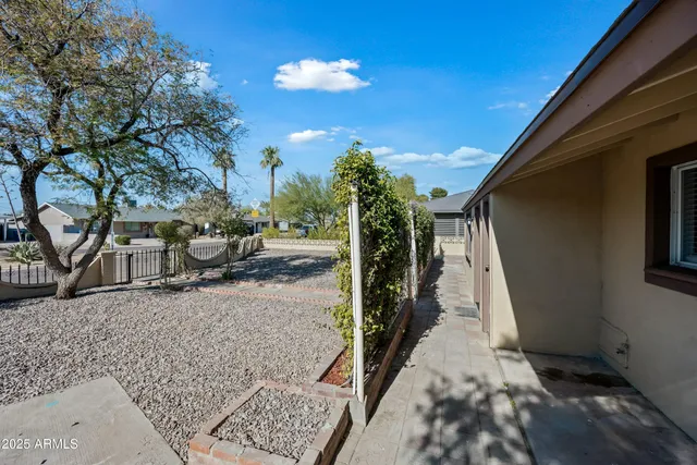 a view of a backyard of the house