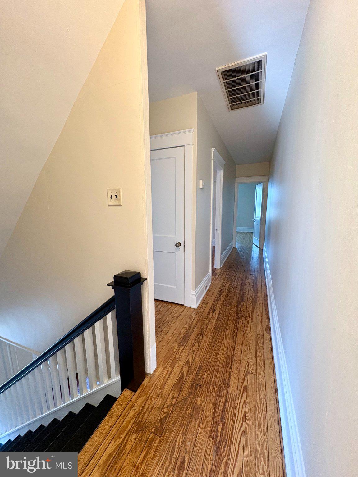 616 North Front Street Wormleysburg, PA 17043 - Photo 15 of 25 a view of a hallway with wooden floor and staircase