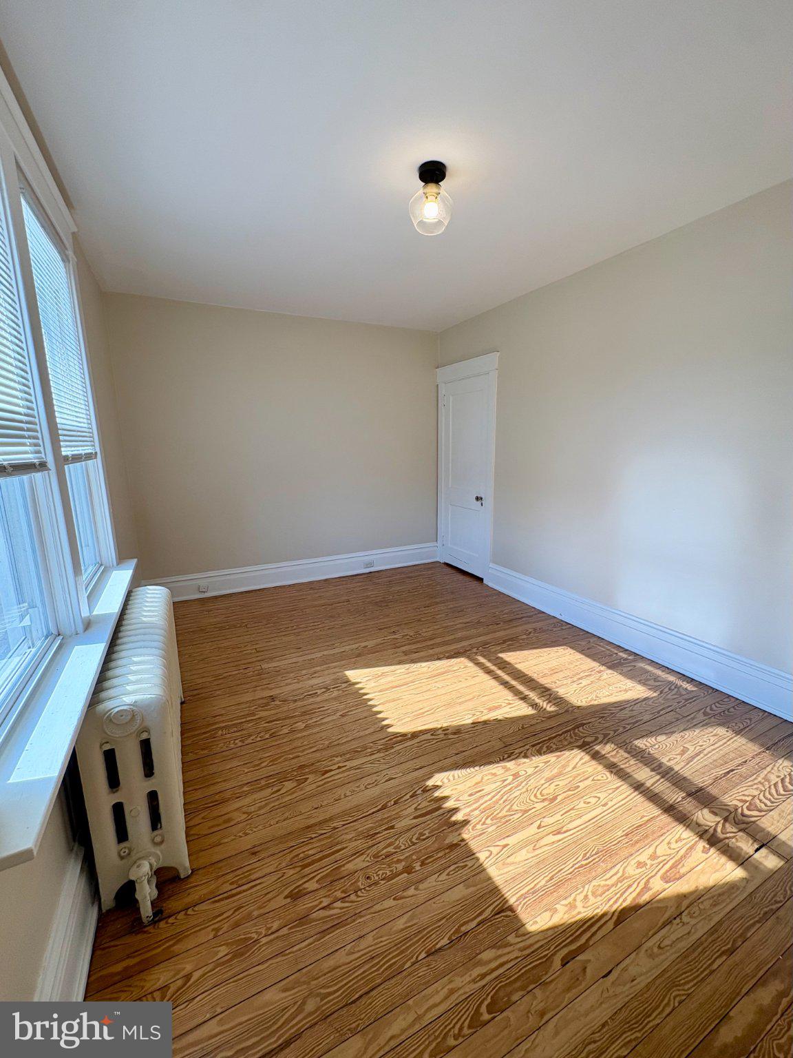 616 North Front Street Wormleysburg, PA 17043 - Photo 16 of 25 an empty room with wooden floor and windows