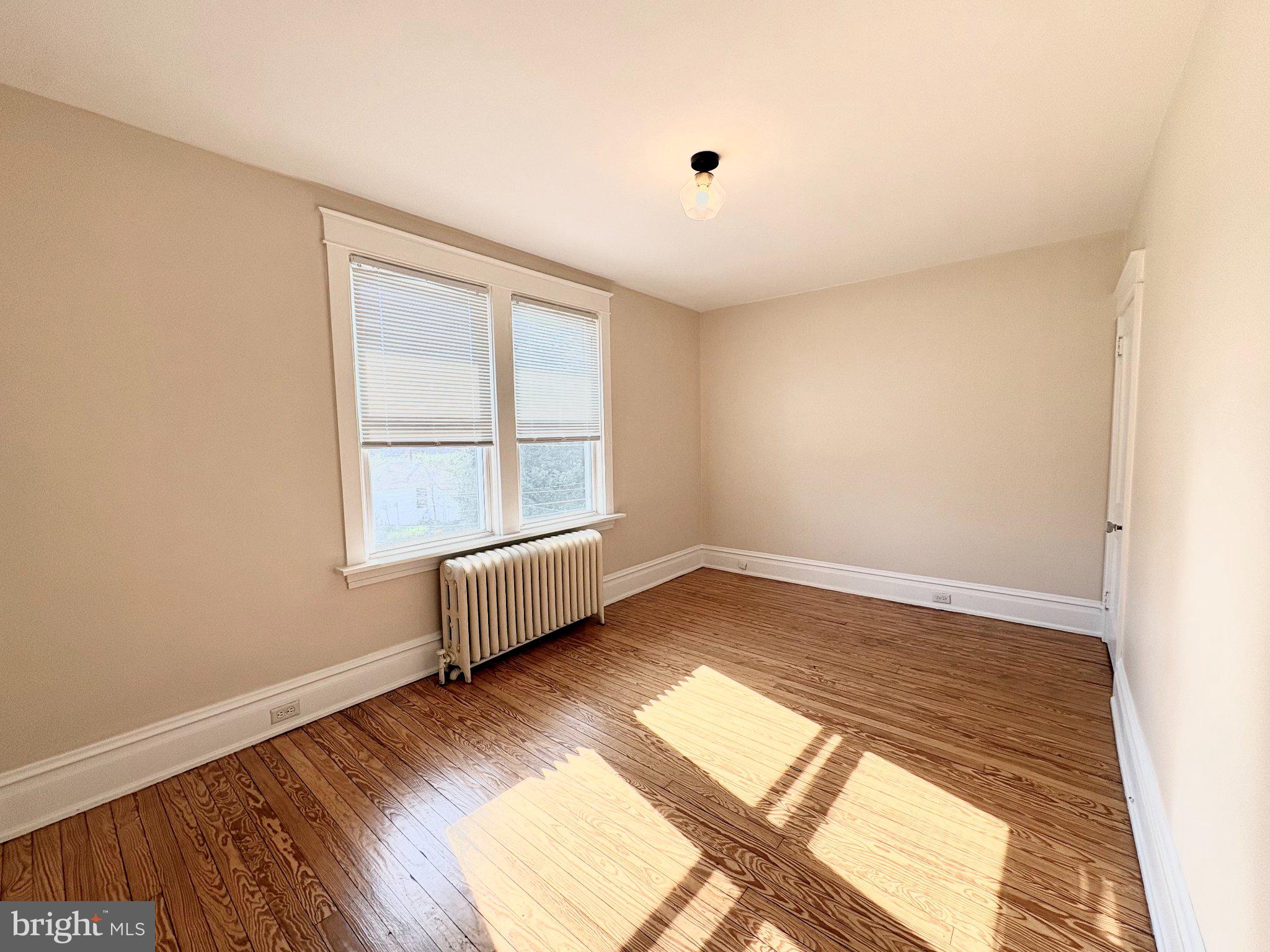 616 North Front Street Wormleysburg, PA 17043 - Photo 17 of 25 an empty room with wooden floor and windows