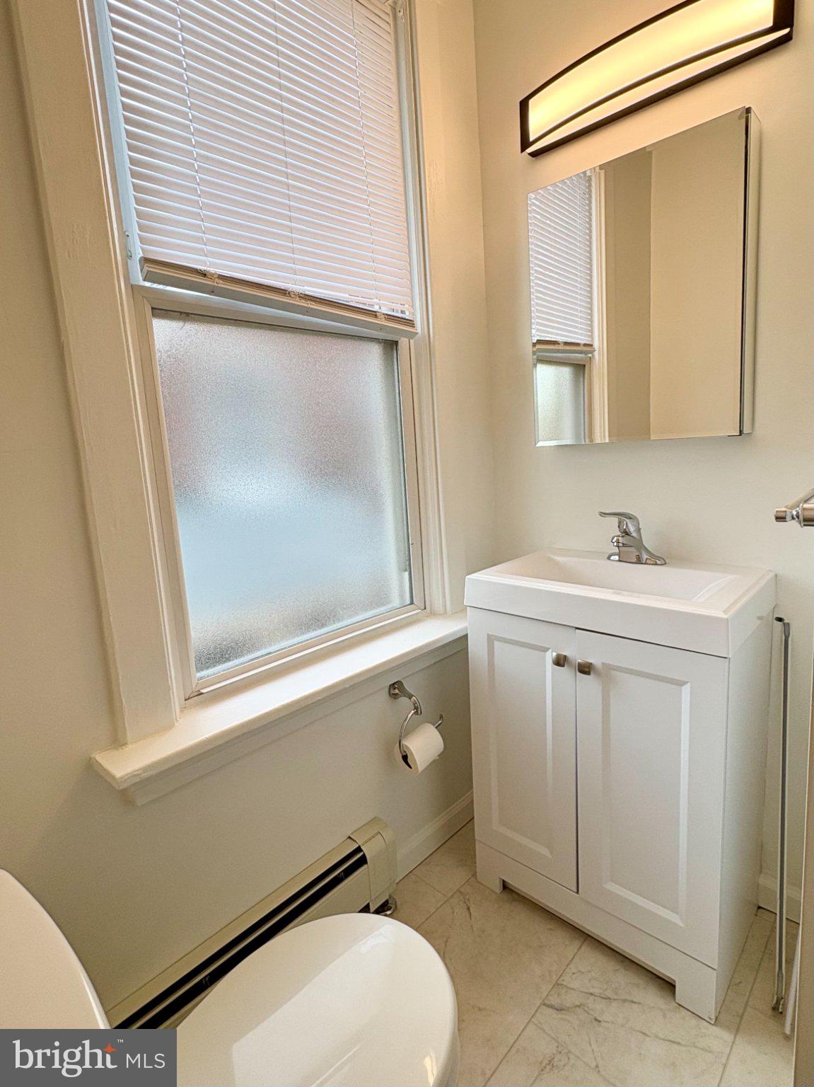 616 North Front Street Wormleysburg, PA 17043 - Photo 18 of 25 a bathroom with a toilet sink and mirror