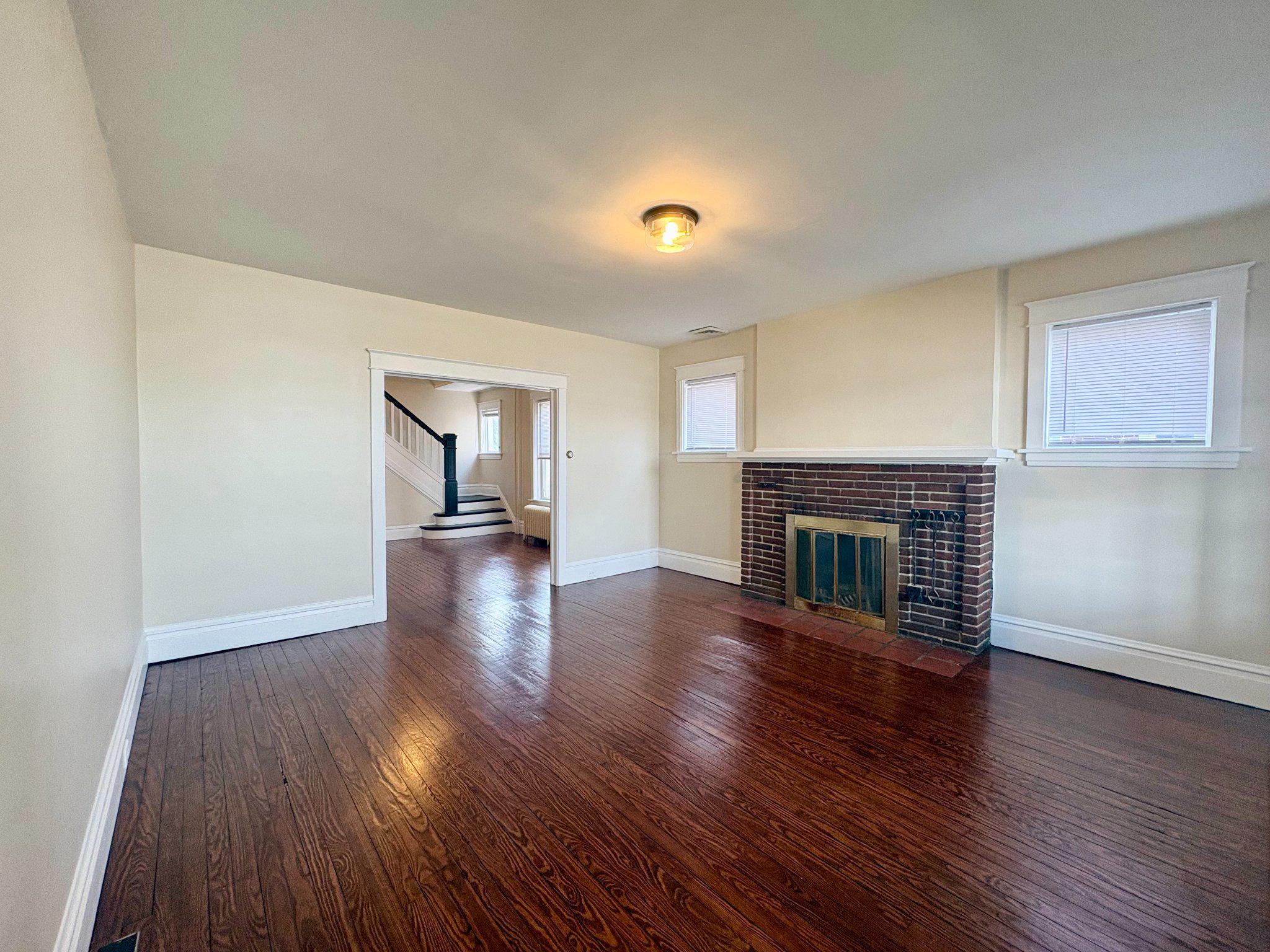 616 North Front Street Wormleysburg, PA 17043 - Photo 5 of 25 a view of a livingroom with wooden floor and a fireplace