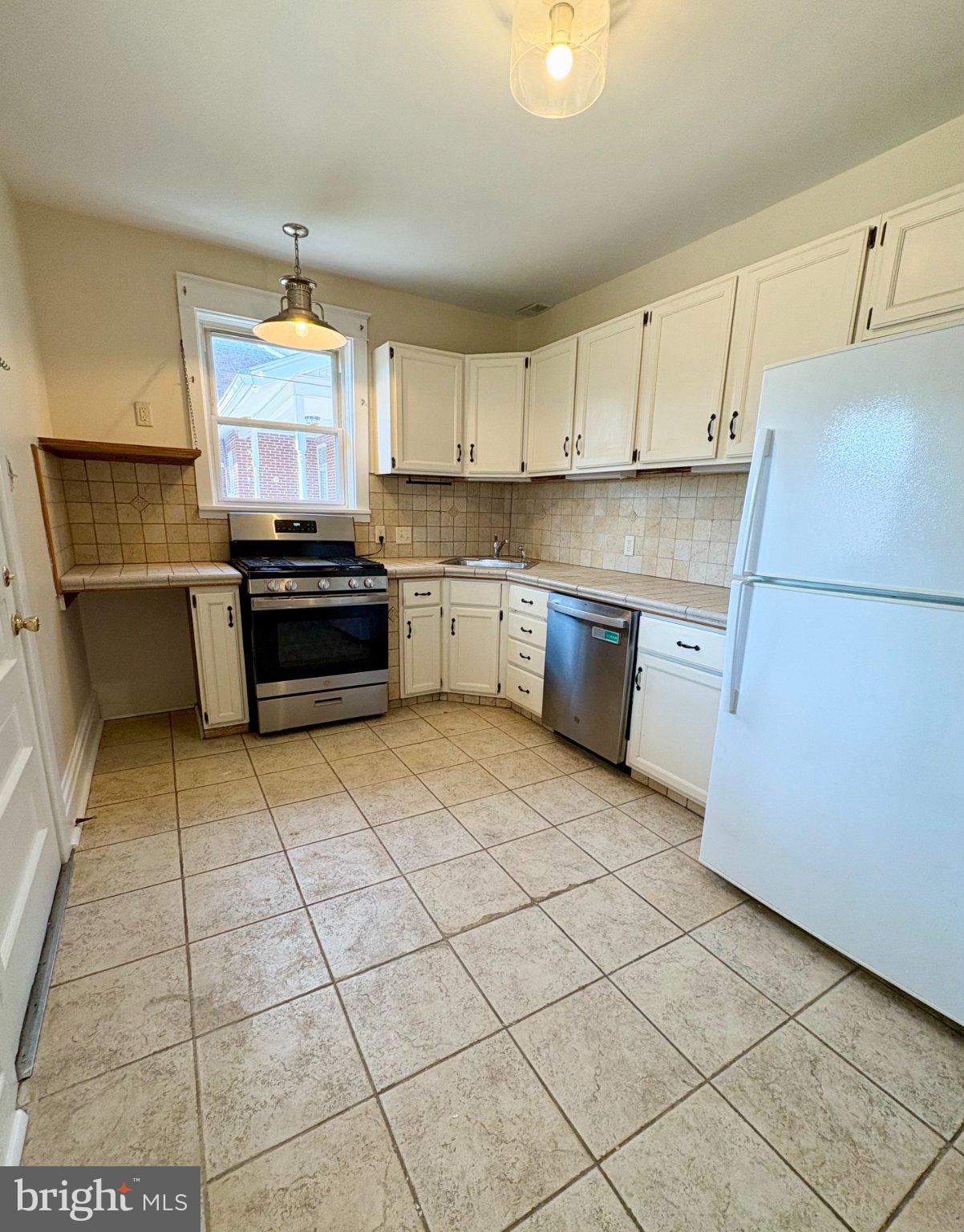 616 North Front Street Wormleysburg, PA 17043 - Photo 10 of 25 a kitchen with stainless steel appliances cabinets a sink and a stove