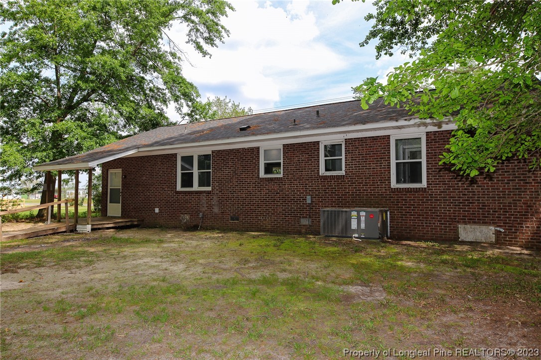 782 Horne Road Rowland, NC 28383 - Photo 21 of 27 a backyard of a house with large trees