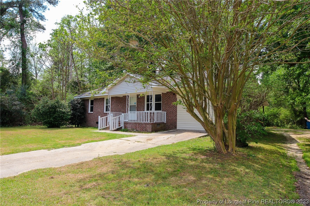 782 Horne Road Rowland, NC 28383 - Photo 23 of 27 a house that has a big yard with large trees