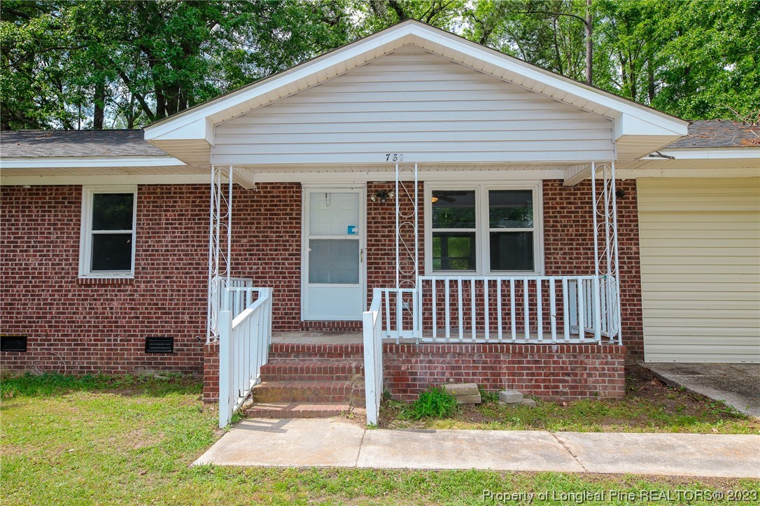 782 Horne Road Rowland, NC 28383 - Photo 3 of 27 a front view of a house with a garden