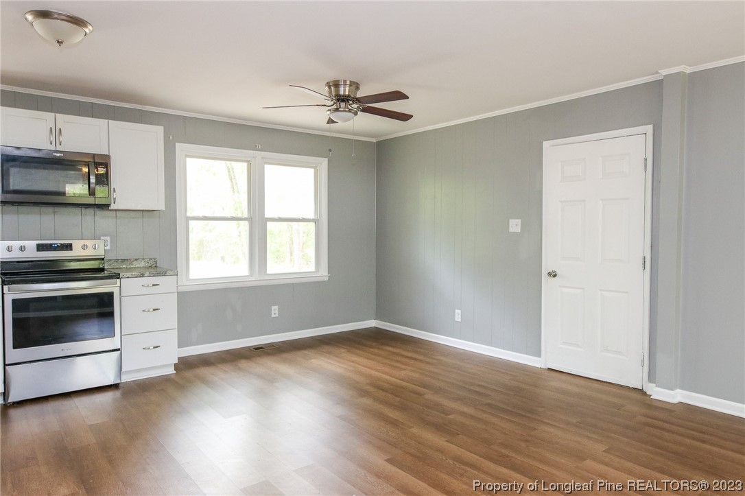 782 Horne Road Rowland, NC 28383 - Photo 6 of 27 a view of kitchen with stainless steel appliances a stove top oven a sink and a window