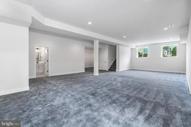 a view of room with window and wooden floor