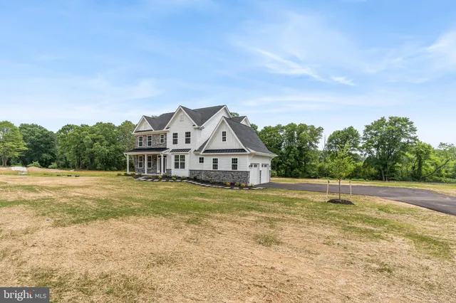 a house with trees in the background