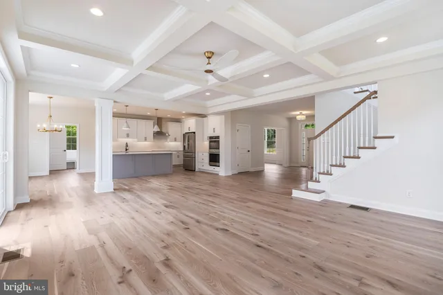 a view of an empty room and wooden floor