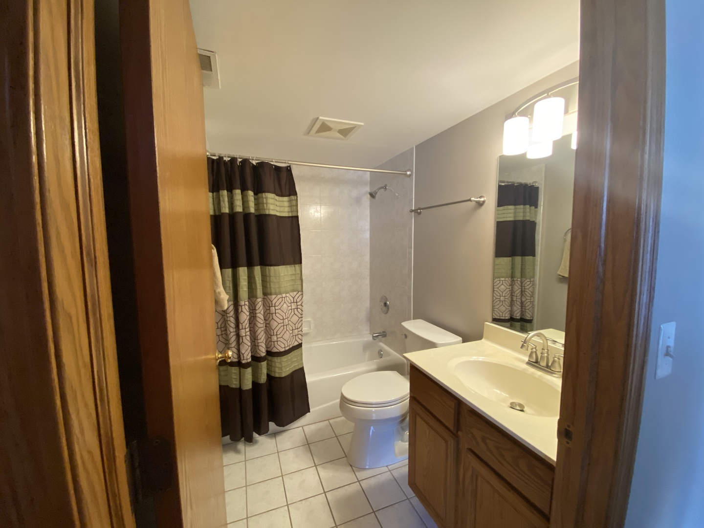 6820 Ridge Point Drive, Unit 21A Oak Forest, IL 60452 - Photo 13 of 16 a bathroom with a granite countertop sink toilet and shower