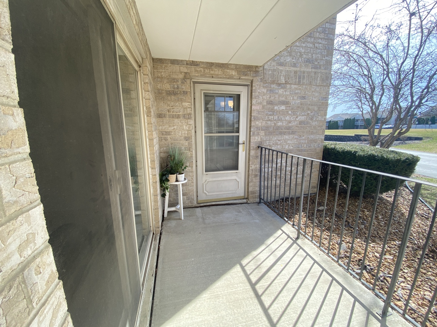 6820 Ridge Point Drive, Unit 21A Oak Forest, IL 60452 - Photo 14 of 16 a view of a balcony with wooden floor