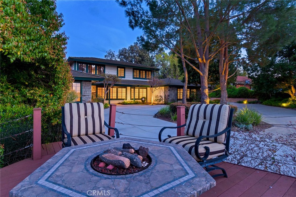 16715 Skycrest Drive Riverside, CA 92504 - Photo 1 of 1 a view of a chairs and fire pit in the patio