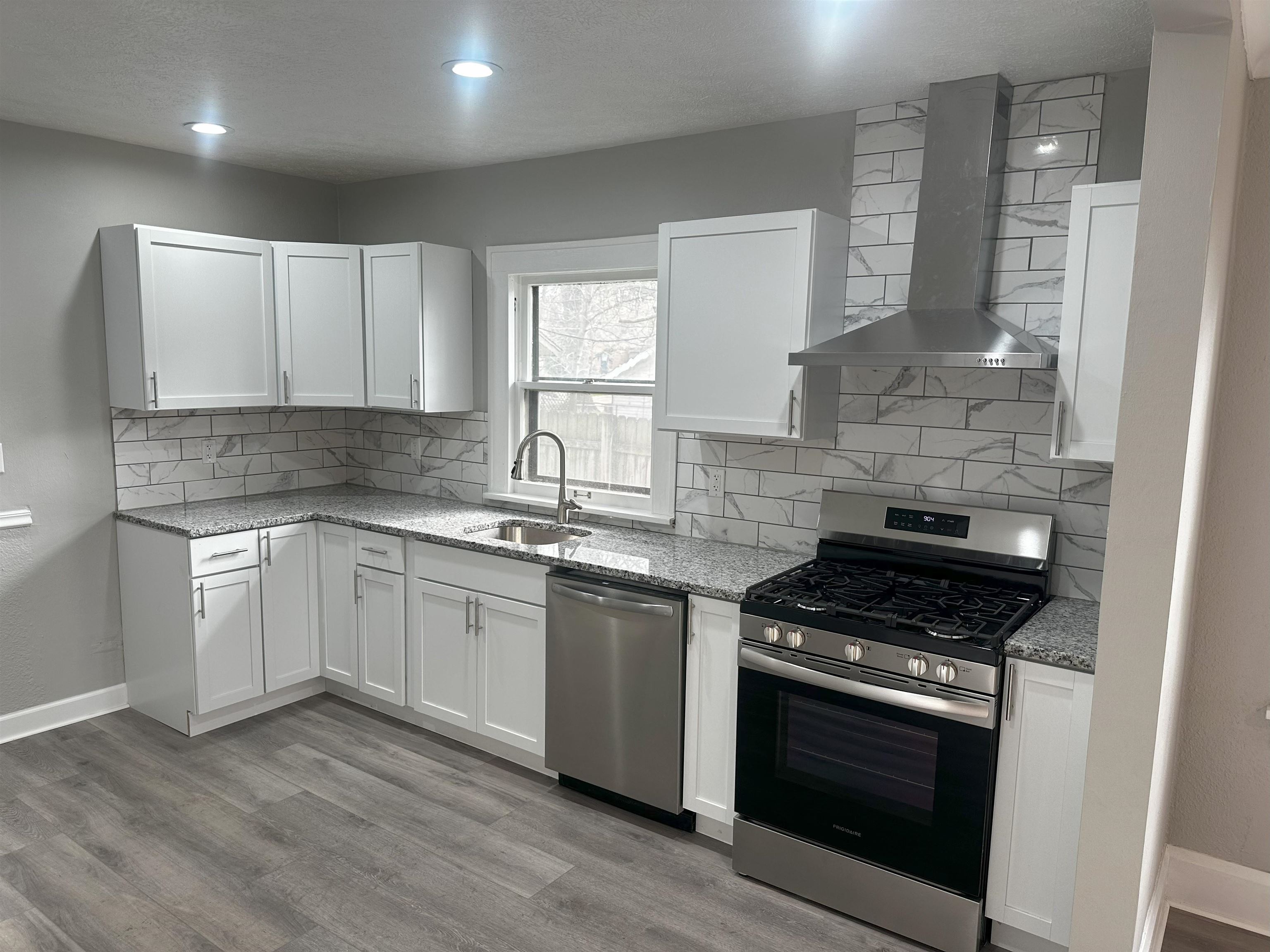 2316 Rural Street Rockford, IL 61107 - Photo 3 of 10 a kitchen with granite countertop cabinets stainless steel appliances and a sink