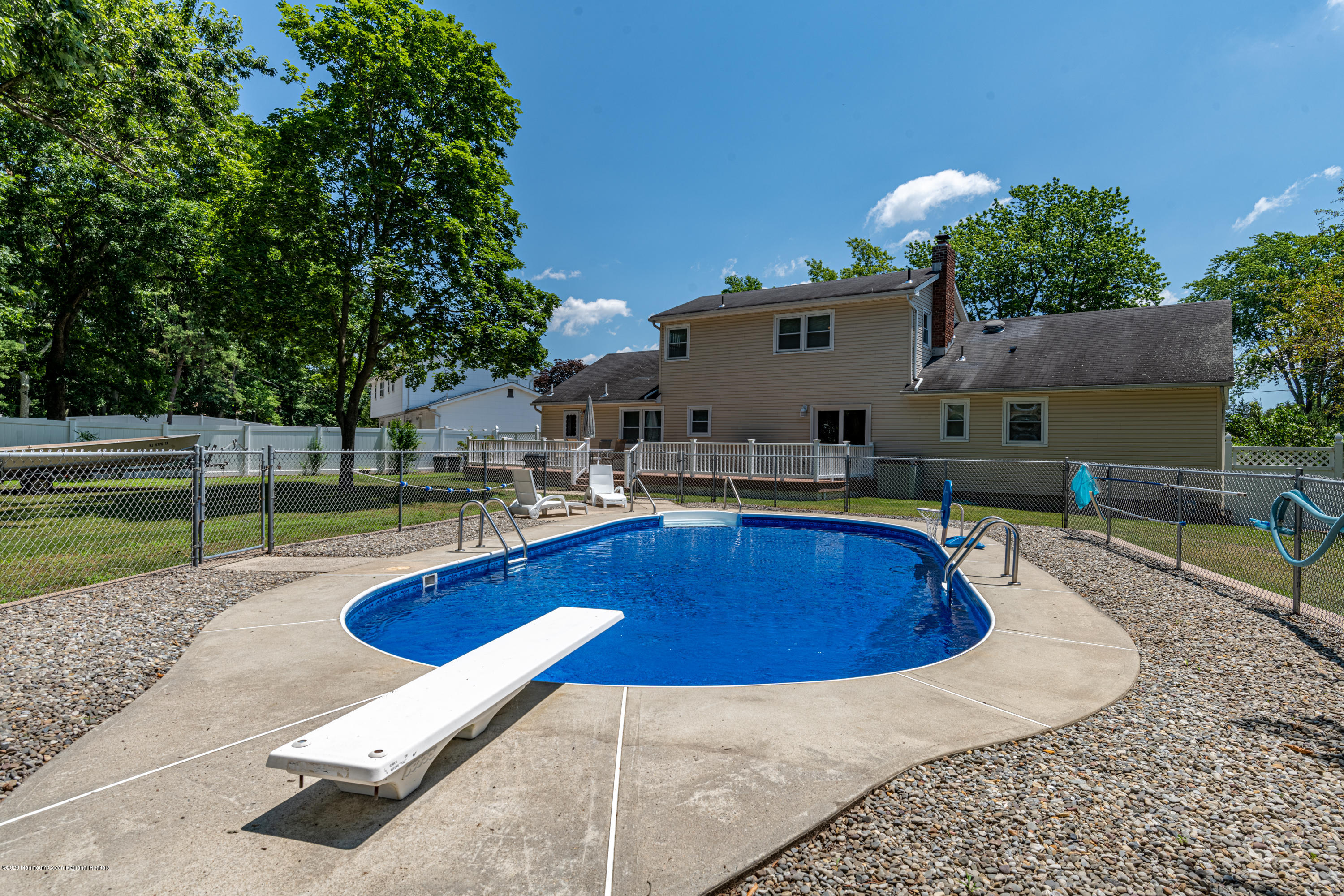 32 South Westfield Road Howell, NJ 07731 - Photo 3 of 28 a swimming pool with outdoor seating and yard