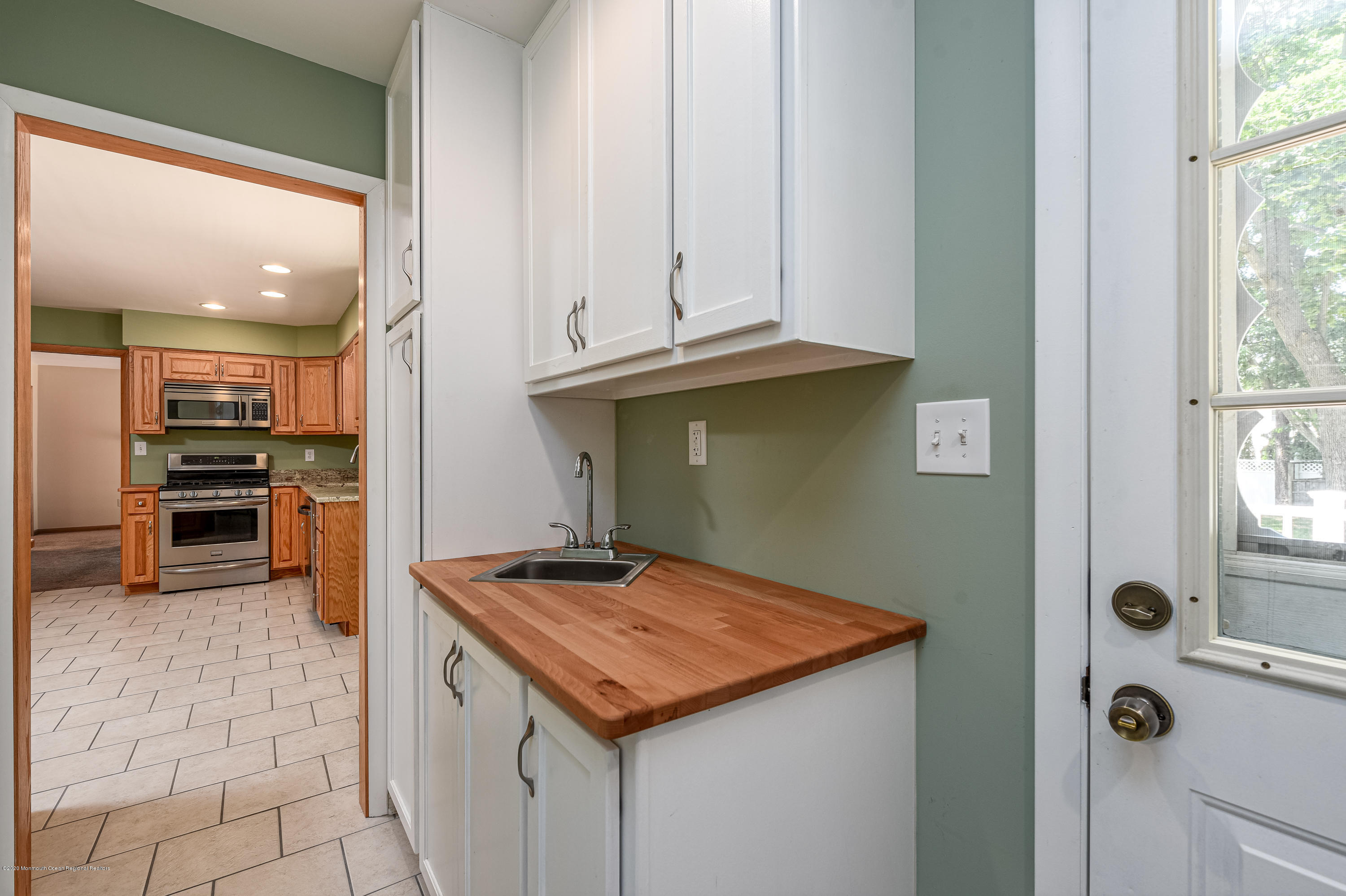 32 South Westfield Road Howell, NJ 07731 - Photo 6 of 28 a kitchen with kitchen island granite countertop a sink a stove and a refrigerator