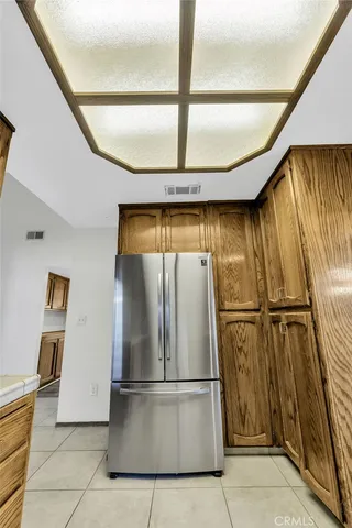 a kitchen with a stove a sink and a refrigerator
