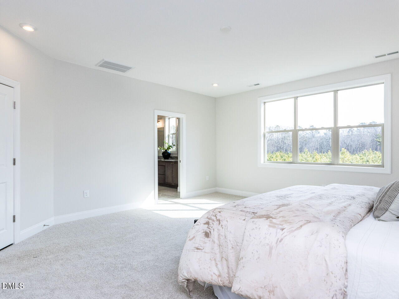 6026 Scalybark Road Durham, NC 27712 - Photo 41 of 55 a bedroom with a bed and a window