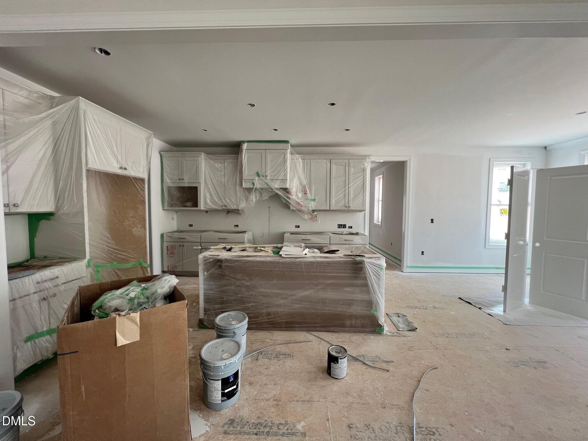 6026 Scalybark Road Durham, NC 27712 - Photo 5 of 55 a large kitchen with a large window stainless steel appliances and cabinets