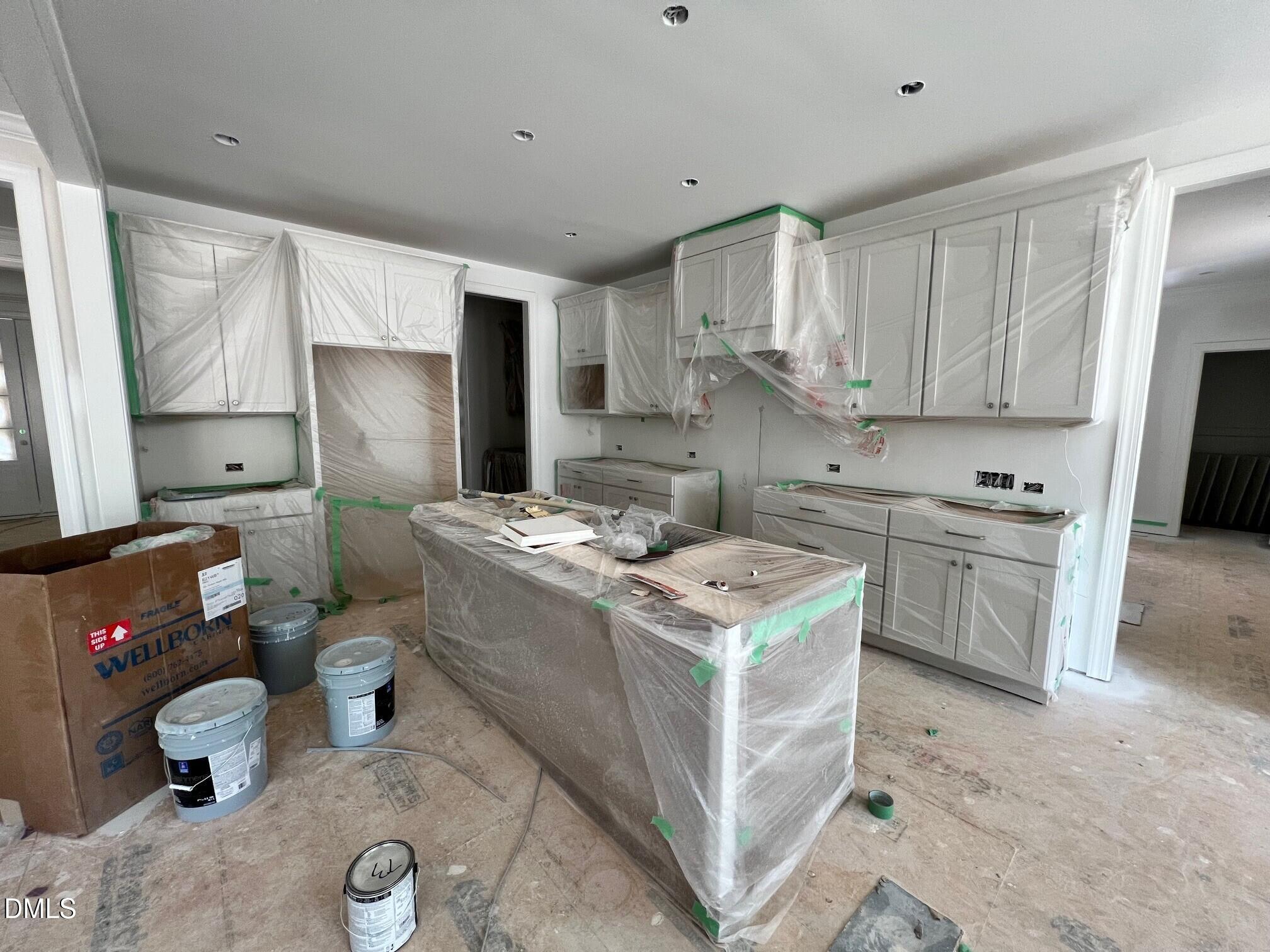 6026 Scalybark Road Durham, NC 27712 - Photo 6 of 55 a kitchen with a sink stove and cabinets