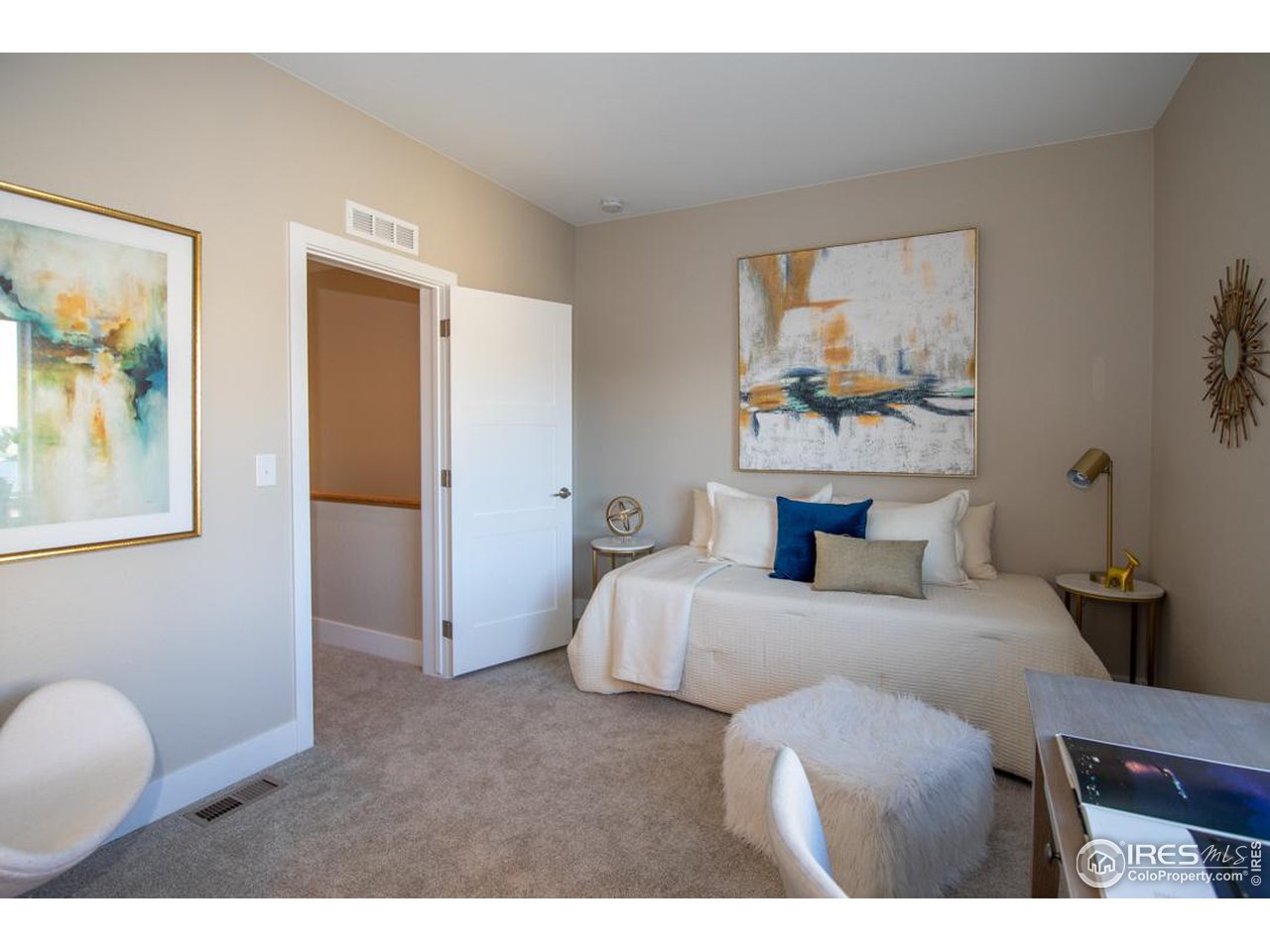 1530 South Terry Street Longmont, CO 80501 - Photo 16 of 21 a bedroom with a bed and wooden floor