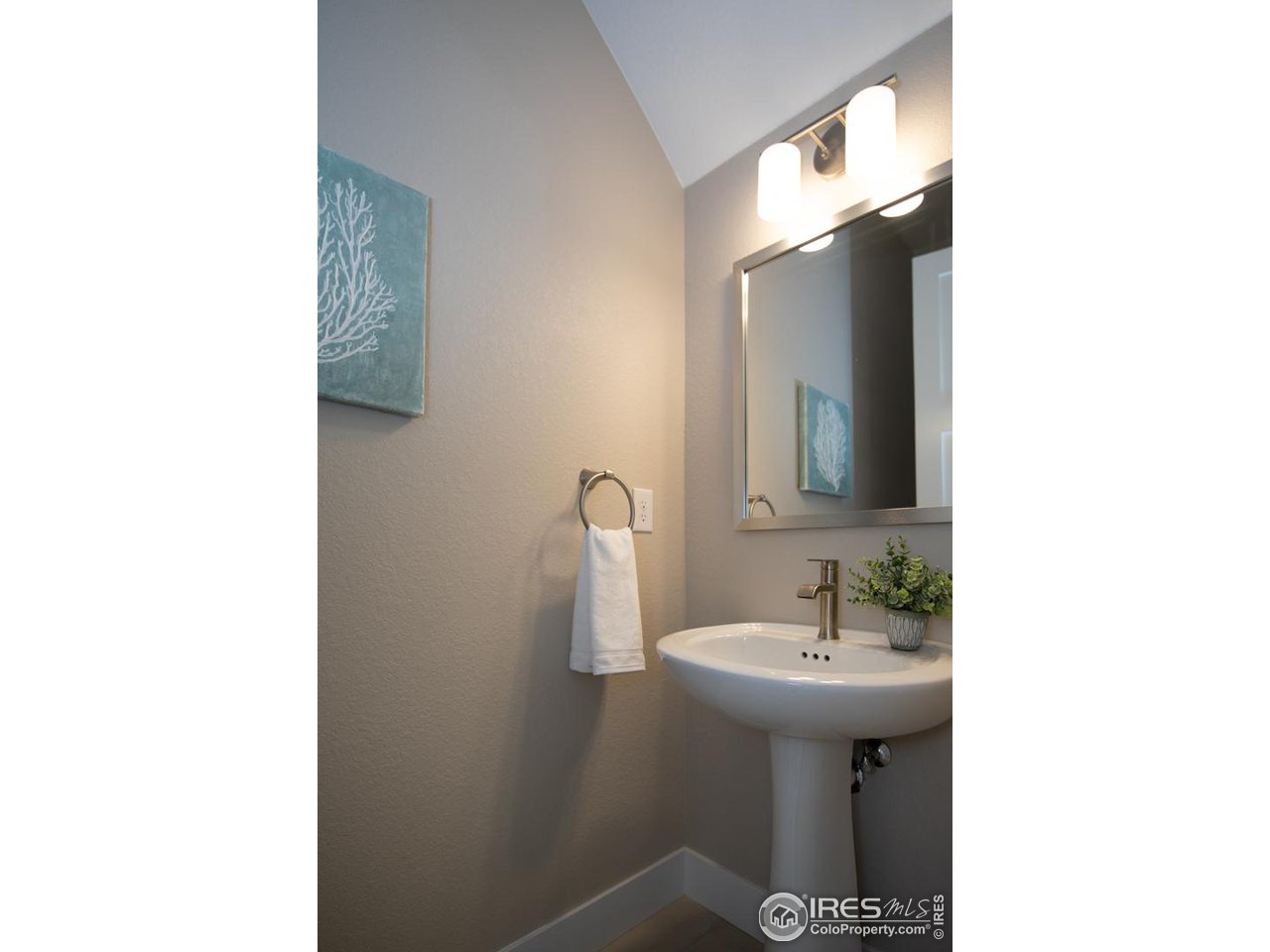 1530 South Terry Street Longmont, CO 80501 - Photo 20 of 21 a bathroom with a sink and a mirror