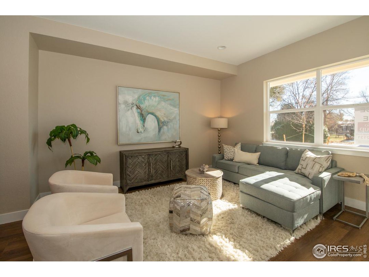1530 South Terry Street Longmont, CO 80501 - Photo 3 of 21 a living room with furniture and a large window
