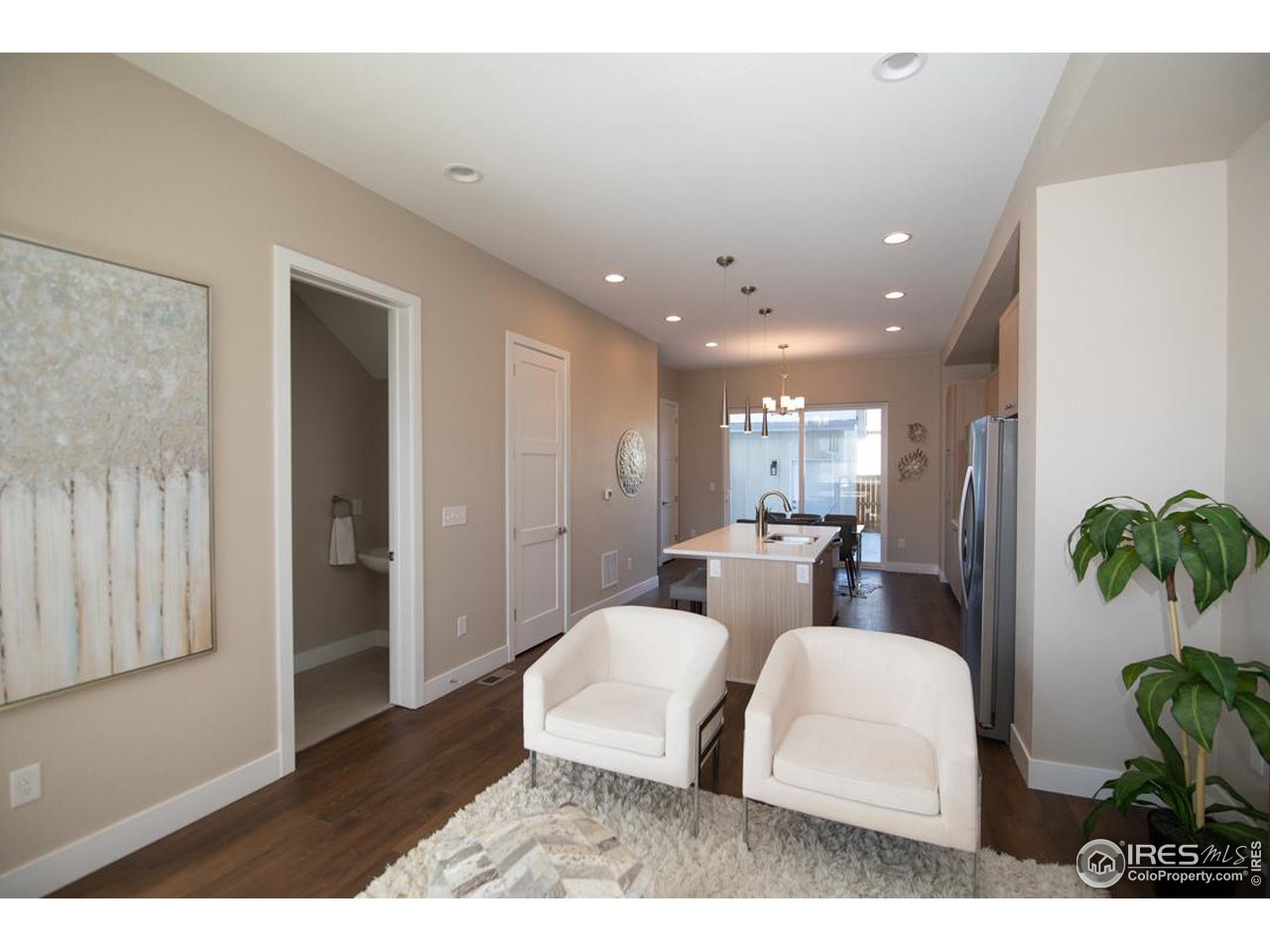 1530 South Terry Street Longmont, CO 80501 - Photo 5 of 21 a living room with furniture and a potted plant