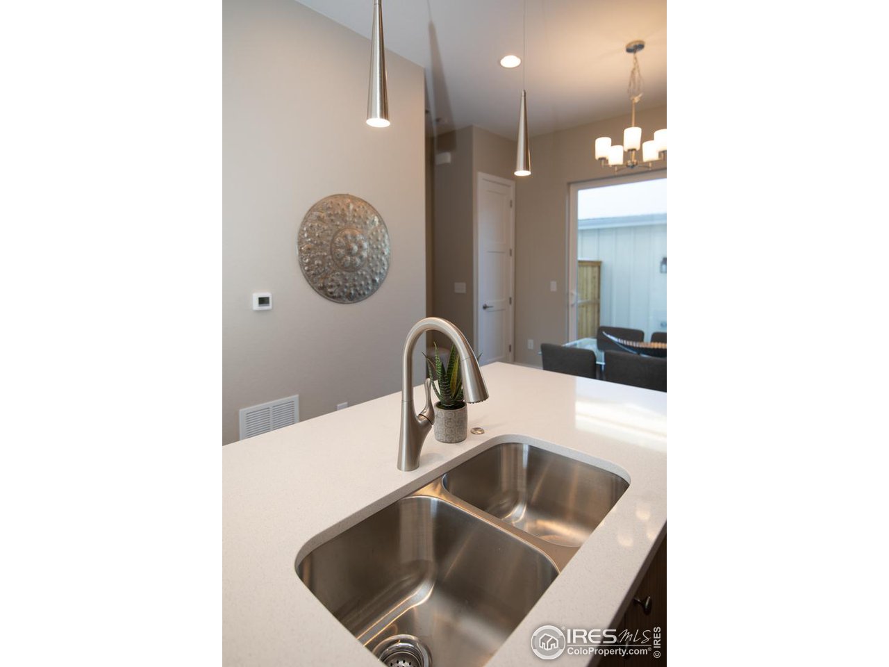 1530 South Terry Street Longmont, CO 80501 - Photo 7 of 21 a bathroom with a sink a toilet and mirror