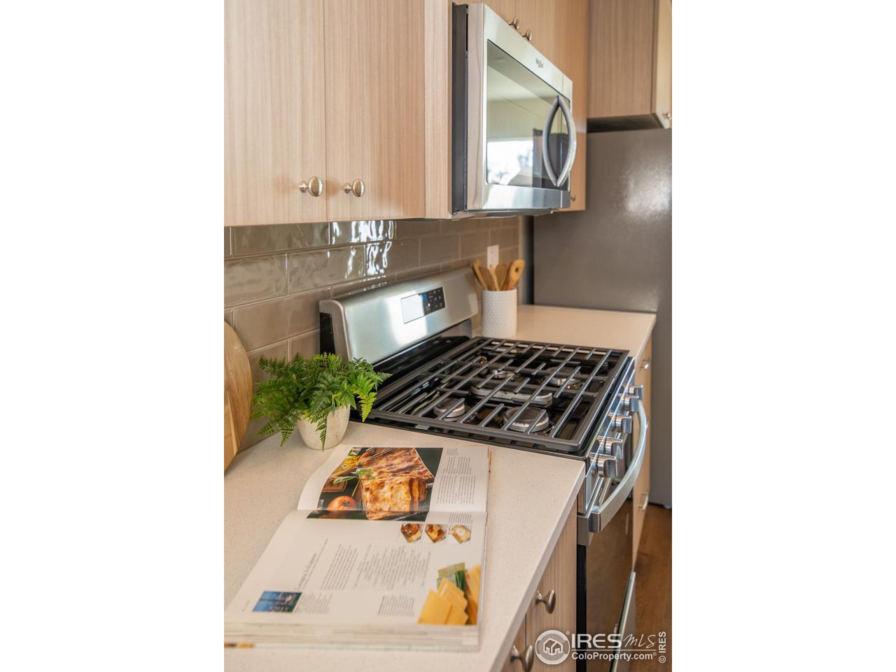 1530 South Terry Street Longmont, CO 80501 - Photo 9 of 21 a kitchen view of a sink and a stove
