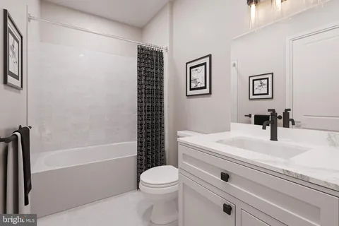 a bathroom with a sink a toilet and a bathtub