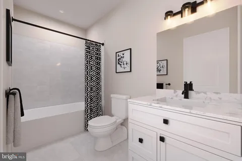 a bathroom with a sink a toilet and a bathtub