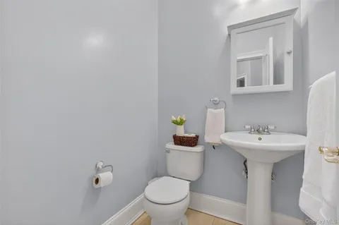 a kitchen with granite countertop a sink and a refrigerator