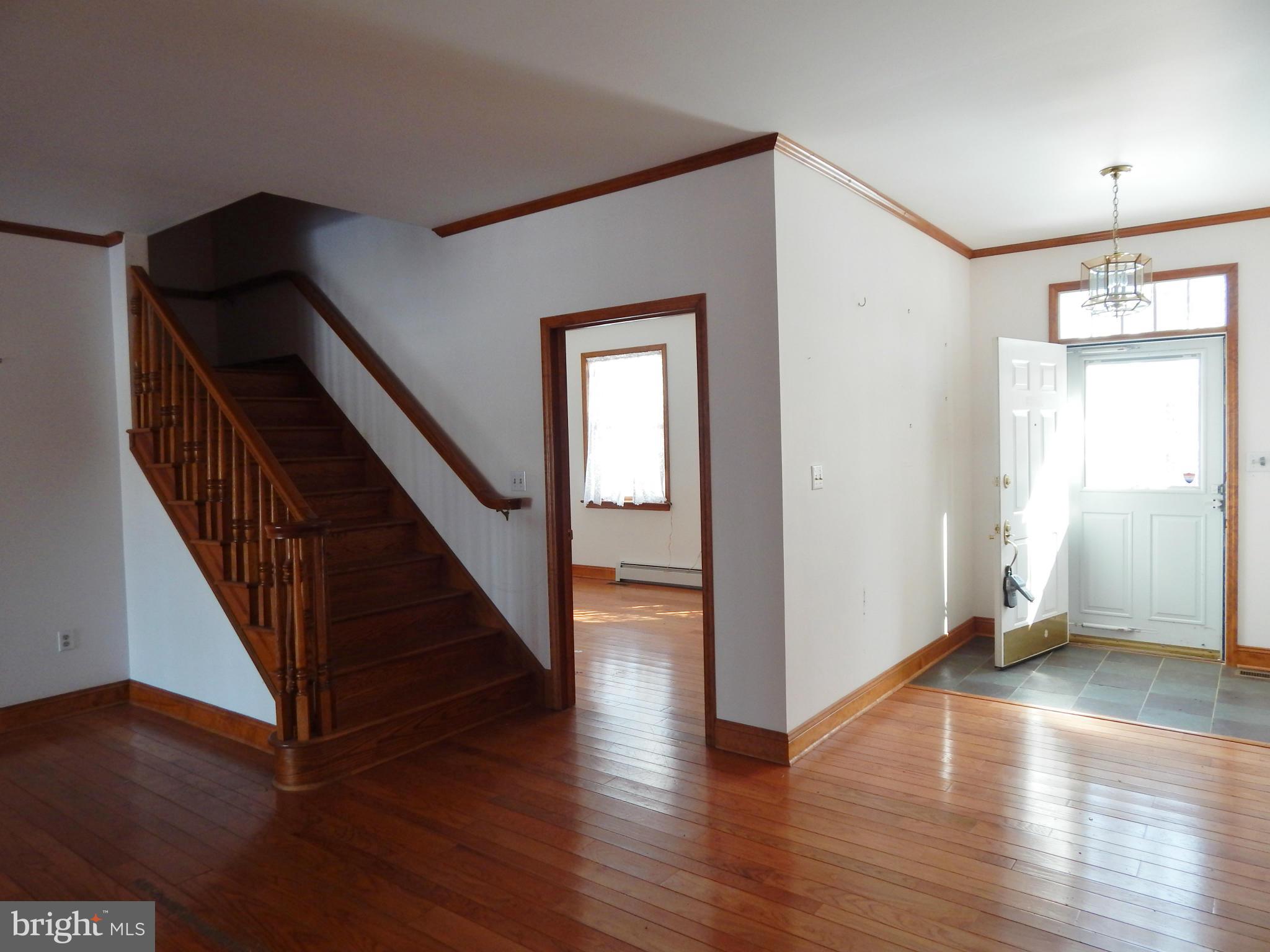 3964 Street Road Street, MD 21154 - Photo 19 of 29 a view of an entryway with wooden floor and stairs