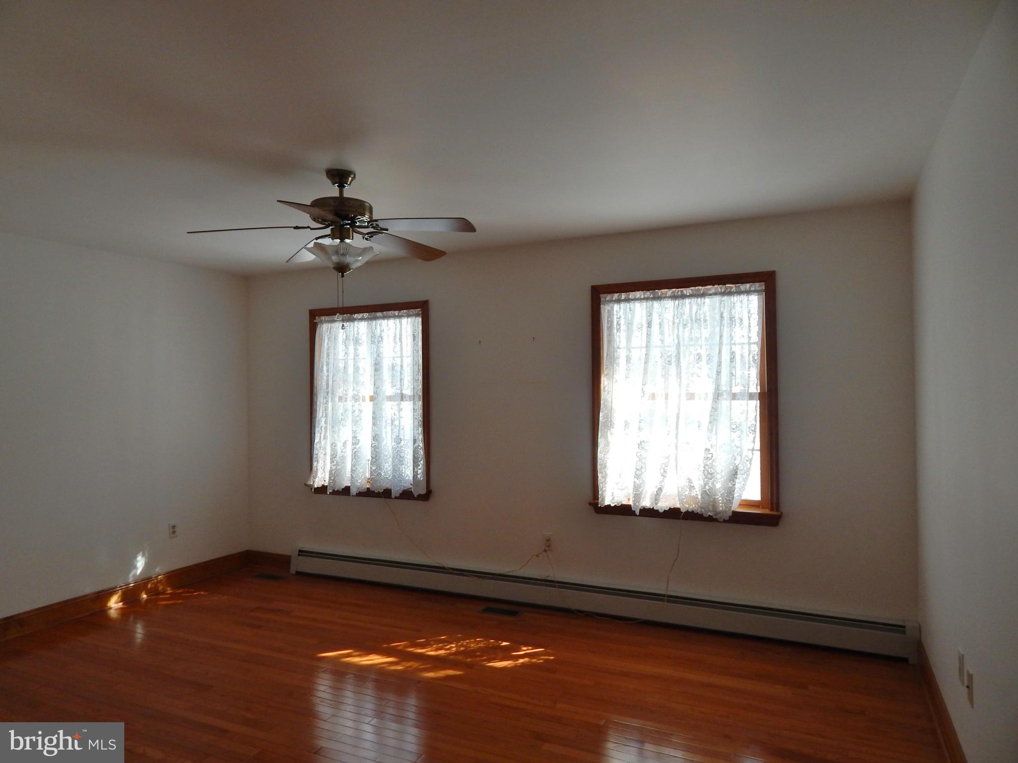 3964 Street Road Street, MD 21154 - Photo 23 of 29 a view of an empty room with wooden floor and a window