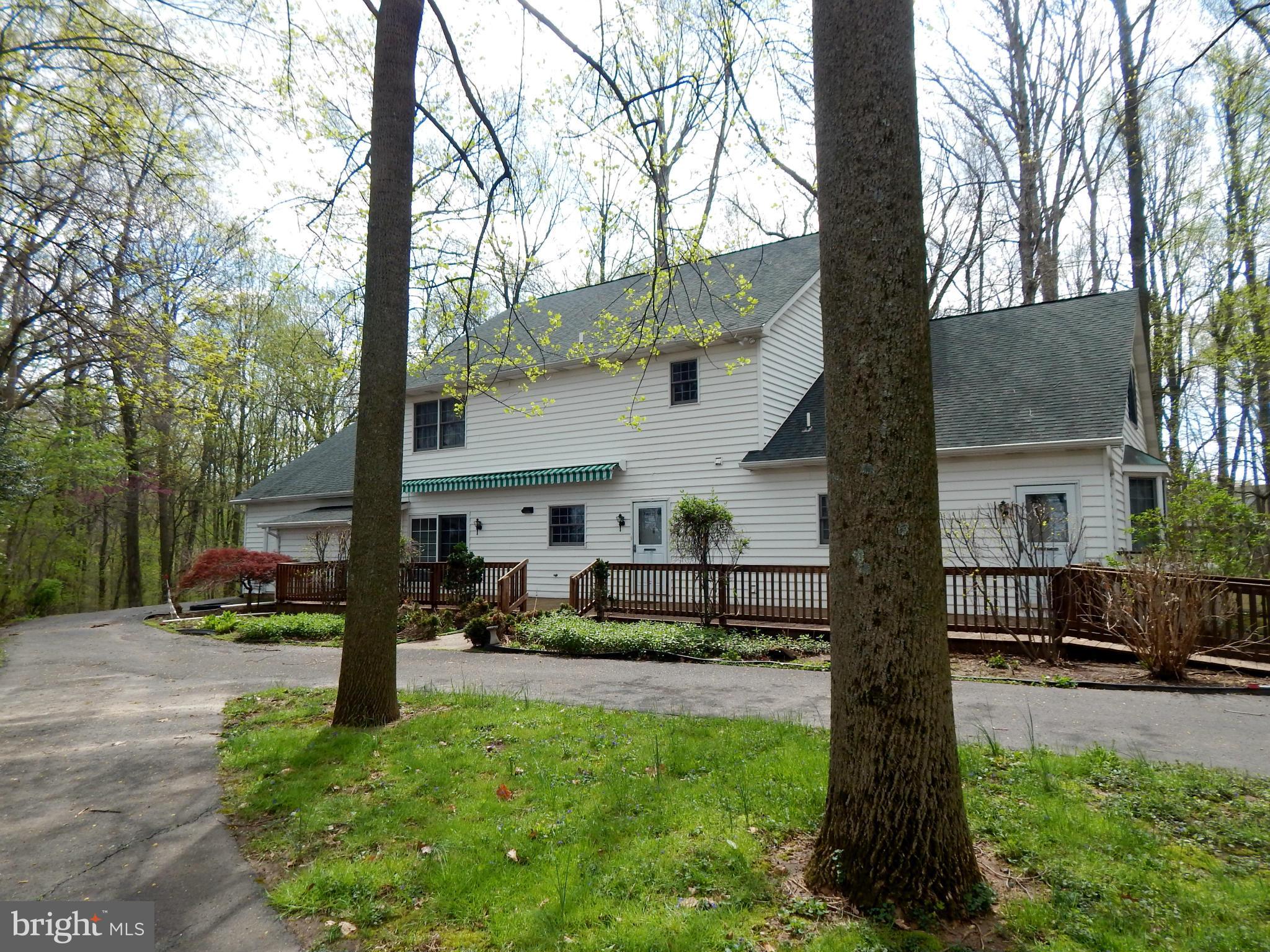 3964 Street Road Street, MD 21154 - Photo 3 of 29 a front view of a house with a yard and a large tree