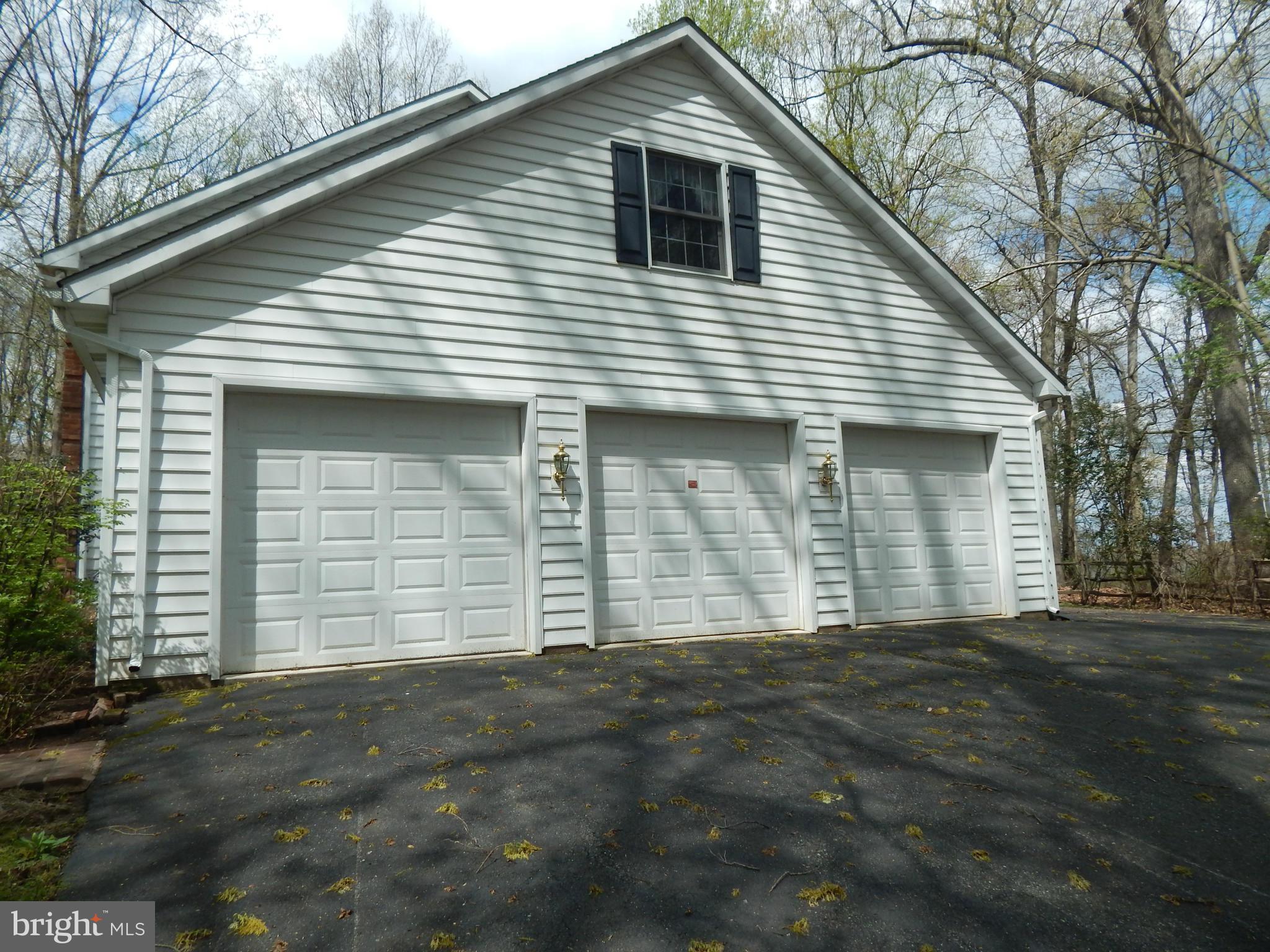 3964 Street Road Street, MD 21154 - Photo 7 of 29 a front view of a house with a garage
