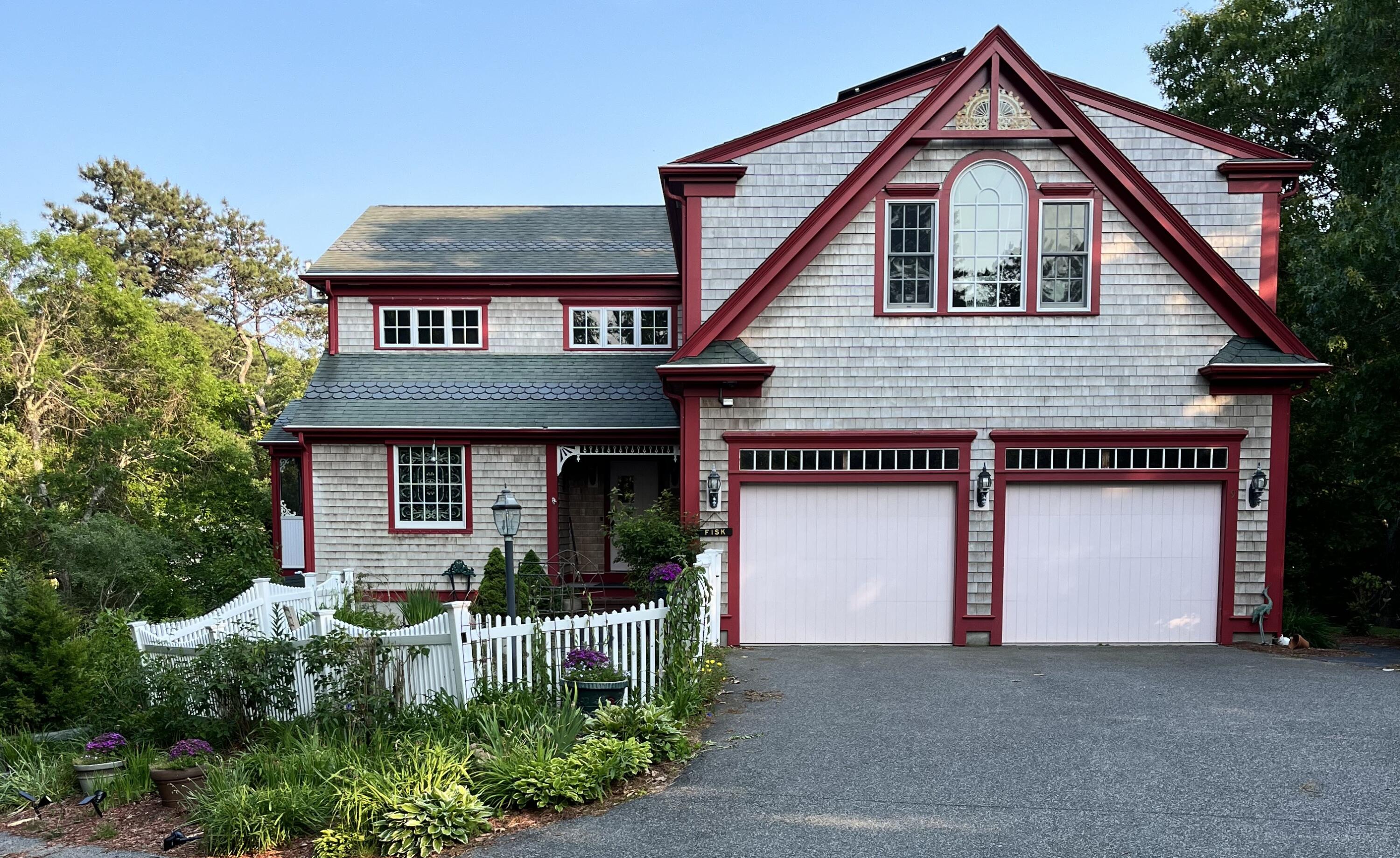 9 Horseshoe Bend Way Mashpee, MA 02649 - Photo 1 of 60 a front view of a house with a garden and plants